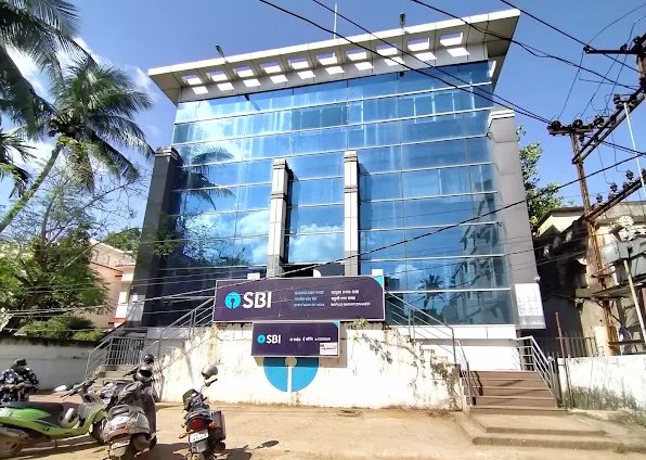SBI Bapuji Nagar branch building — multi-storey glass facade
