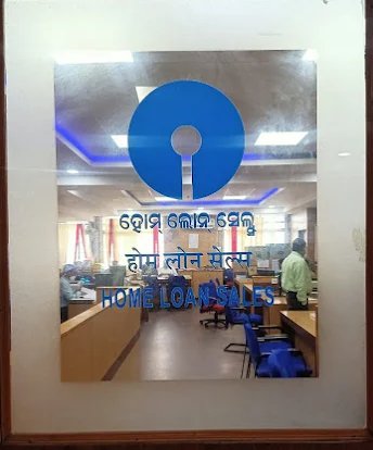 SBI Home Loan Sales office glass door in Bhubaneswar showing Home Loan Sales in Odia
