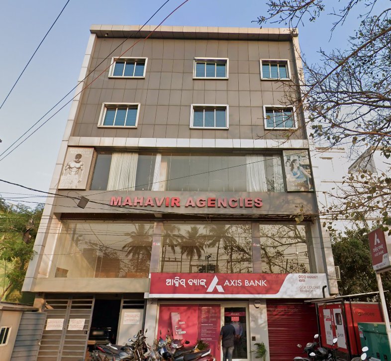 Axis Bank GGP Colony Branch Rasulgarh Bhubaneswar in Mahavir Agencies building with Odia signage